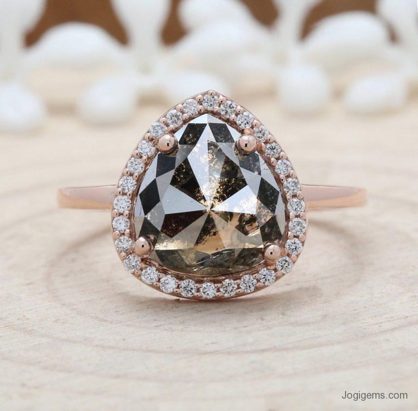 Pear shaped rose cut salt and pepper diamond ring in rose gold. 