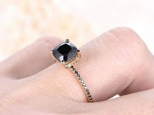 Cushion Cut Black Diamond Ring on the finger