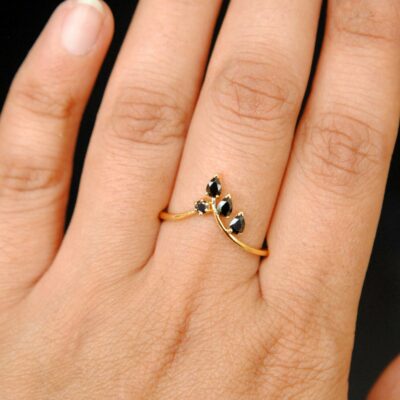 black diamond leaf ring on finger