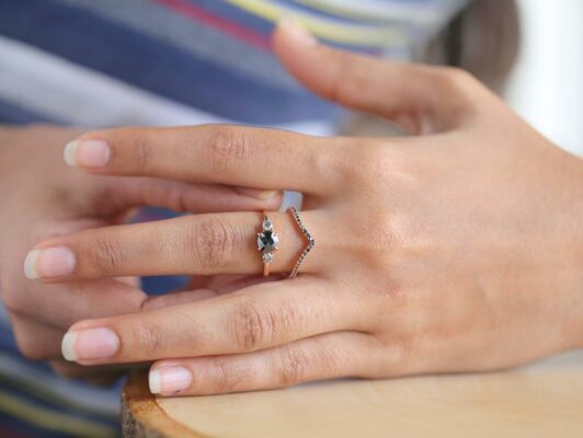 rose cut black diamond bridal ring in finger