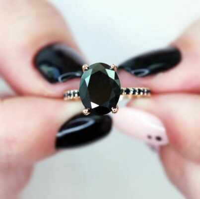 oval black diamond engagement ring meaning